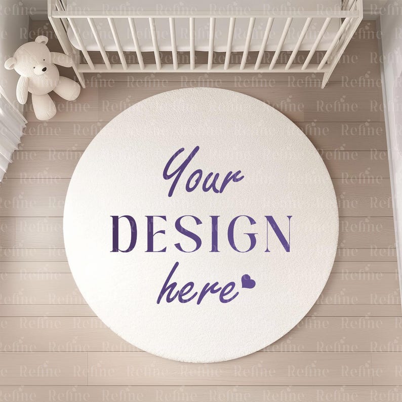 May include: A white round rug with the text "Your DESIGN here" in purple lettering. The rug is on a light brown wood floor in a nursery setting.