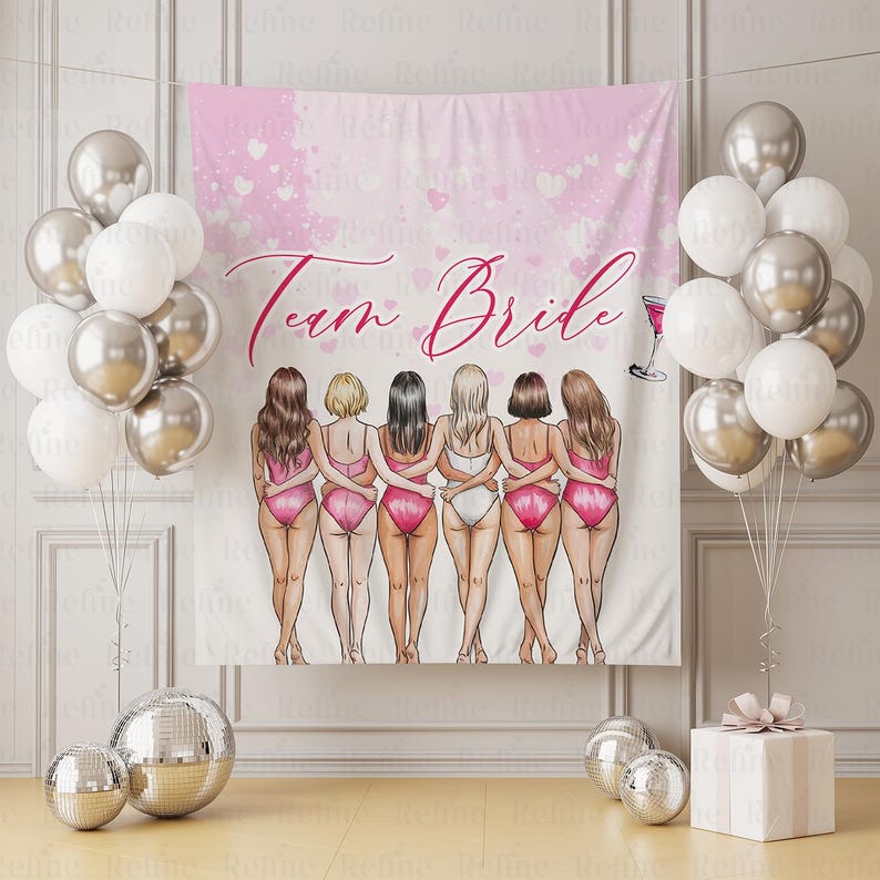 May include: A pink and white backdrop with the text "Team Bride" and an illustration of seven women in swimsuits. Silver and white balloons, disco balls, and a gift box complete the party scene.