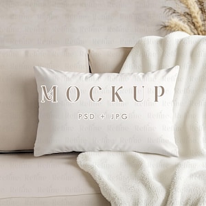 May include: White pillow with the word "MOCKUP" and the text "PSD + JPG" on a white couch with a white blanket.