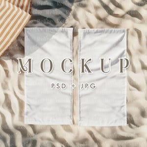 May include: Two white blank banners on a beige textured background. The banners are laying flat on the surface. The text "MOCKUP" and "PSD + JPG" is printed on the banners.