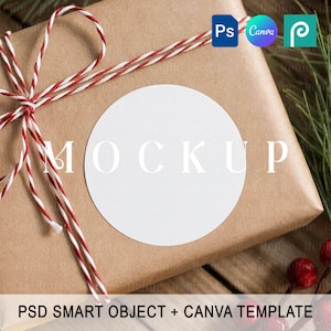 May include: A wrapped gift with a white circular label that says "MOCKUP". The gift is wrapped in brown paper and tied with red and white twine. The image also includes the text "PSD SMART OBJECT + CANVA TEMPLATE".