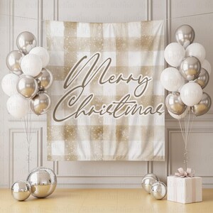 May include: A festive Christmas backdrop with a beige and white plaid pattern, adorned with the words "Merry Christmas" in elegant script. Silver and white balloons, disco balls, and a wrapped gift complete the holiday scene.