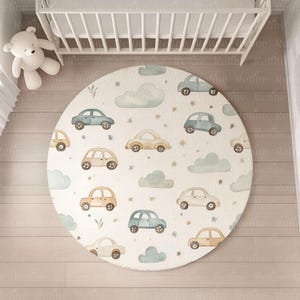 May include: A round, cream-colored play mat with a watercolor design of blue and brown cars, clouds, and stars.