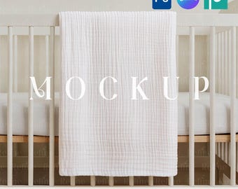 May include: A white baby crib with a white blanket draped over the side. The word "MOCKUP" is displayed on the blanket. The text "PSD SMART OBJECT + CANVA TEMPLATE" is at the bottom.