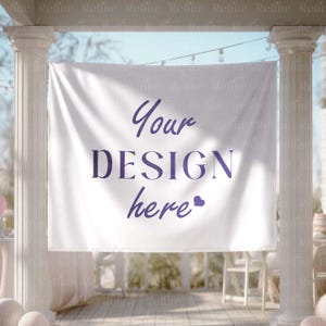 May include: A white banner with the text "Your DESIGN here" in purple script and a heart symbol. The banner is hanging between two white pillars, with a blurred background of outdoor decor.
