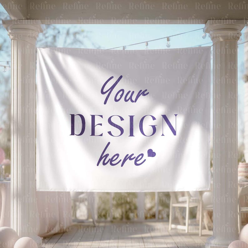 May include: A white banner with the text "Your DESIGN here" in purple script and a heart symbol. The banner is hanging between two white pillars, with a blurred background of outdoor decor.