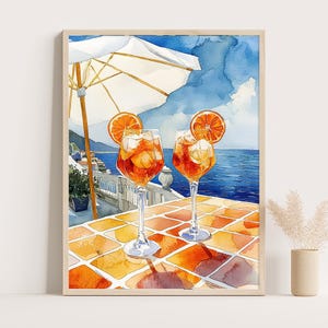 Stampa acquerello Aperol Spritz – Cocktail mediterraneo con fette d'arancia, vista sul caffè costiero e tavolo piastrellato