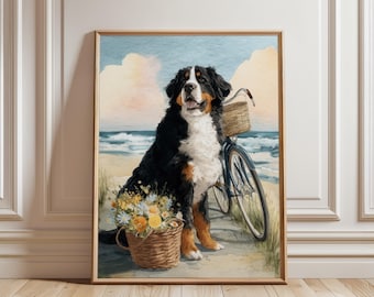 Puede incluir: Una impresión en acuarela enmarcada de un perro de montaña bernés sentado en una playa junto a una bicicleta con una cesta. El perro es negro, blanco y marrón. Una cesta de flores está frente al perro. El fondo muestra el mar y el cielo.