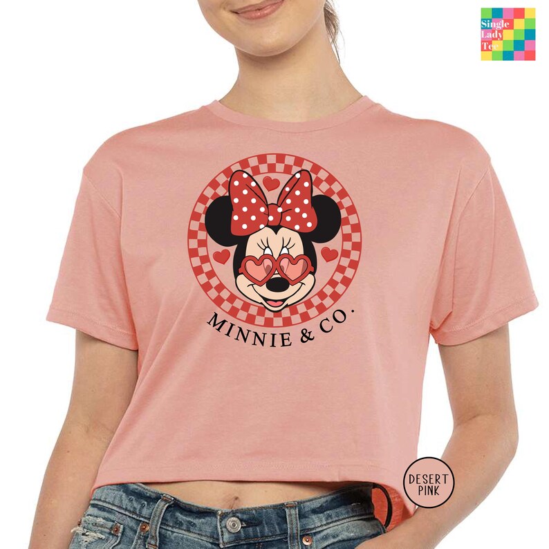 a woman wearing a minnie mouse crop top