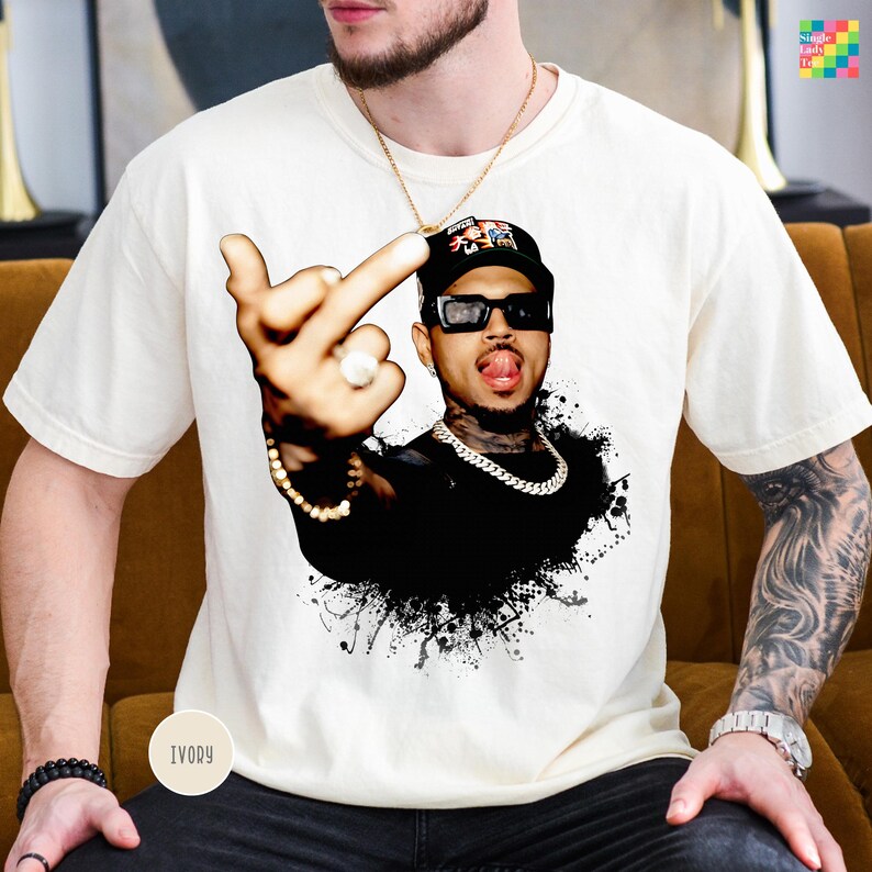 A man wearing a white t-shirt with a graphic of a man making a hand gesture.