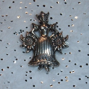 Vintage Sterling Silver Dutch Girl Pin by Coro Edelweiss Flowers.  Measures approx. 1 1/8&quot; Stamped STERLING