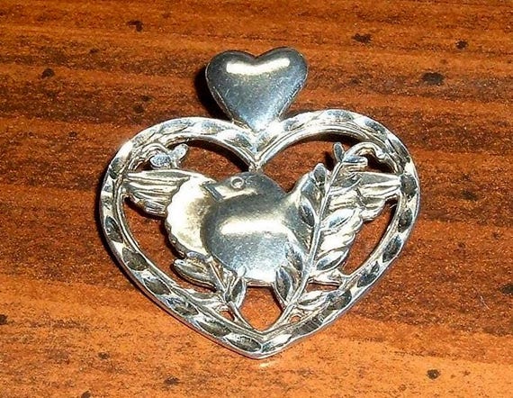 Sterling silver Dakota West Sweetheart Love Bird Heart Pendant, 1 1/4", lightweight and comfortable.
