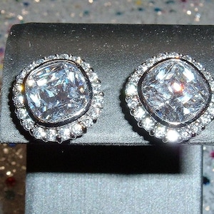 Sterling silver cushion-cut halo cubic zirconia earrings, signed DBJ 925, with post backs.