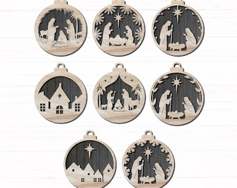 May include: A collection of wooden Christmas ornaments, each in a round shape with a cutout design. The ornaments depict scenes from the Nativity, including the Holy Family, stars, and houses. The wood has a natural, light color.