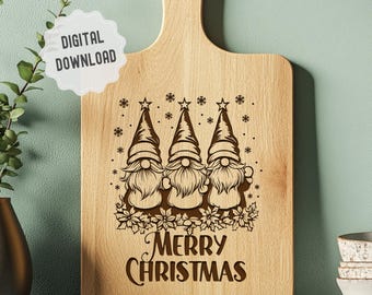 May include: A wooden cutting board with a design of three gnomes wearing Santa hats and the text "Merry Christmas".
