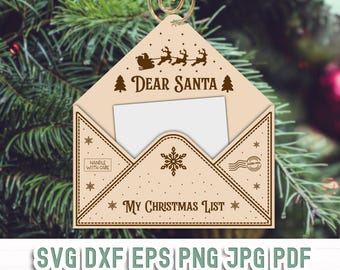 May include: A beige envelope ornament with a brown border and a snowflake design. The envelope has a blank space for writing a letter to Santa and the text "Dear Santa" and "My Christmas List".