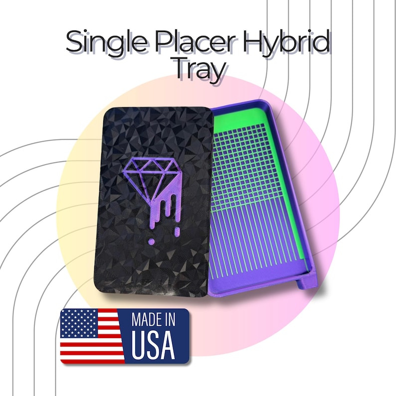 May include: A rectangular Single Placer Hybrid Tray with a black lid featuring a purple diamond graphic. The interior is purple with a bright green grooved base. A blue rectangular label with the American flag and the text MADE IN USA is visible.
