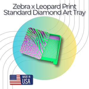 May include: A bright green diamond art tray with a sliding lid featuring a purple and neon green zebra and leopard print pattern. The text Zebra x Leopard Print Standard Diamond Art Tray is visible at the top, and a Made in USA flag icon is at the bottom.