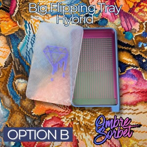 A hybrid Big Flipping Tray for diamond art in blue, pink, and clear. The clear lid features a purple diamond design. The tray has a grid and vertical lines for organizing drills. The text "Option B" is visible.