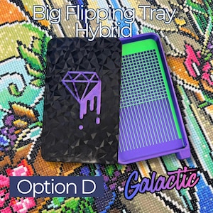 A black Big Flipping Tray Hybrid for diamond art with a geometric pattern and a purple diamond design. The tray is open, revealing a green and purple interior. Text includes "Big Flipping Tray Hybrid", "Option D", and "Galactic".
