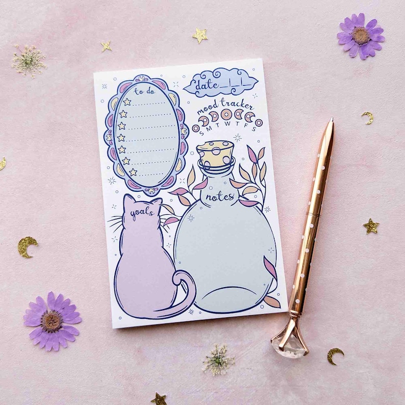 This photo shows an overhead view of the pastel notepad version with a pen next to it for scale.