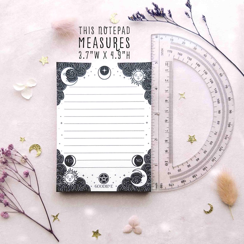This photo shows the black and white version of the notepad next to a ruler for scale, with the text, this notepad measures 3.7 inches wide by 4.9 inches high