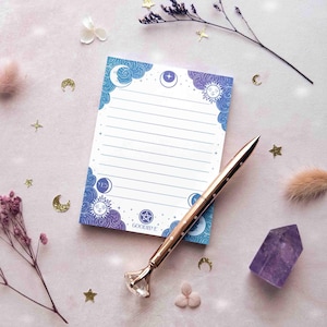 This photo shows an overhead view of the jewel toned notepad with a pen on it for scale.