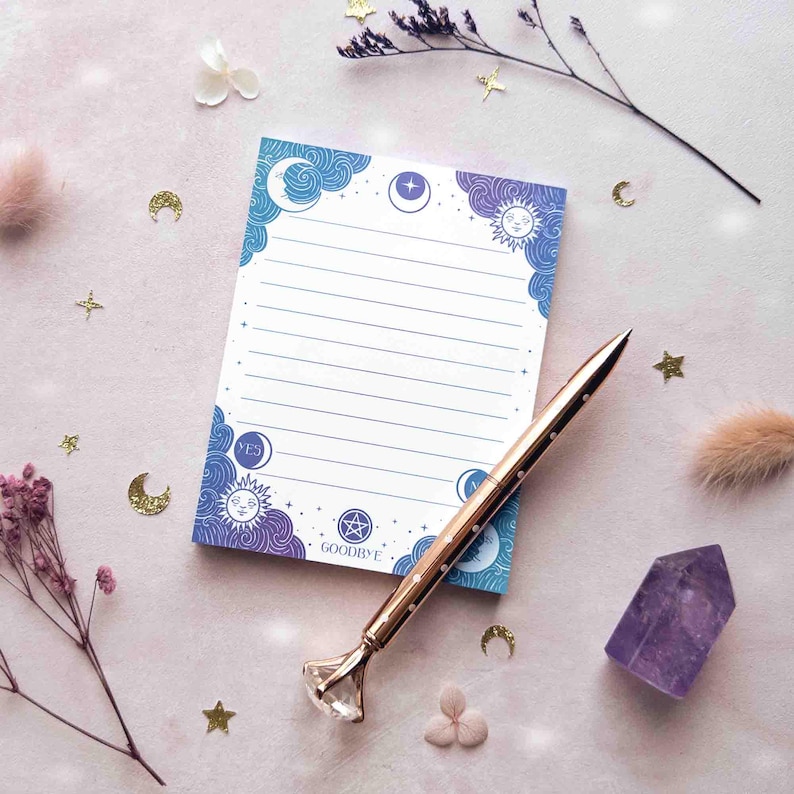 This photo shows an overhead view of the jewel toned notepad with a pen on it for scale.