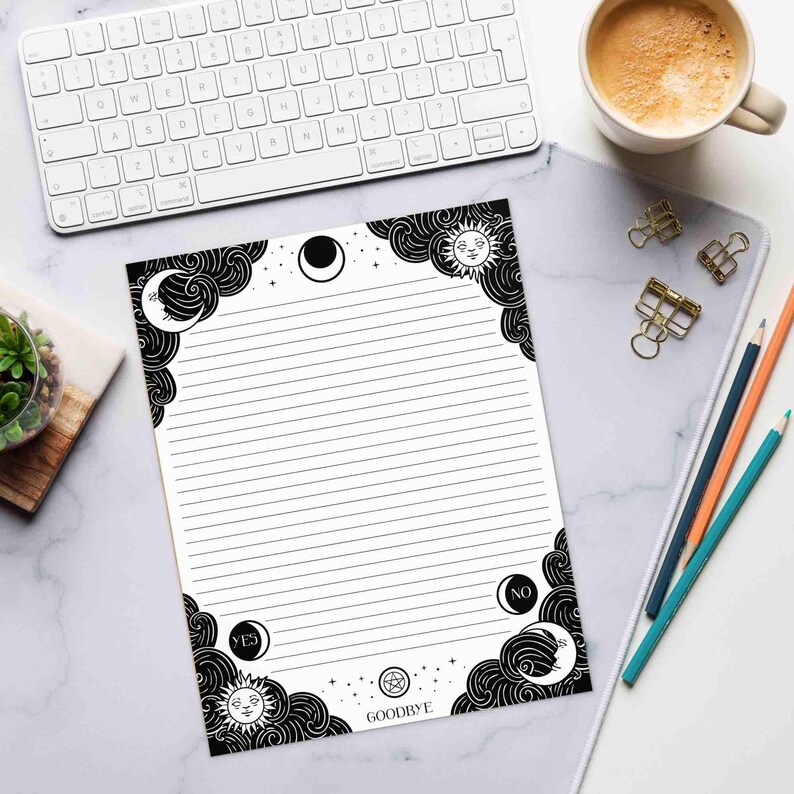This photo shows the 8.5 by 11 inch notepad on a desk with writing utensils for size comparison