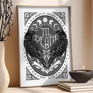 Unframed matte print that features 2 ravens in the shape of a heart & the words, “til death” in the center. Moon phases, botanical illustrations and hearts surround the ravens. The couple’s first names and anniversary date are arched on top and bot