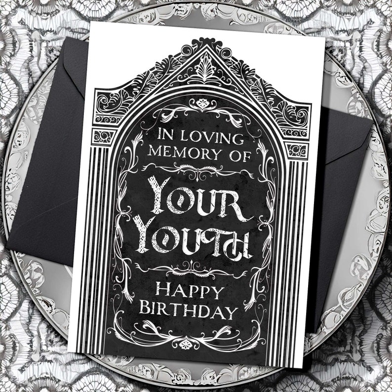 Printable bday card that is 5x7” and vertical. Features an illustrated black gravestone with ornate borders and the words, “in loving memory of your youth. Happy birthday”