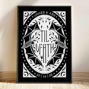 This photo shows the black and white version of this printable wall art. The art features two bats. Their wings form the shape of a heart with the words til death framed the center of the art. Crescent moons, botanical illustrations and small hearts surround the bats. The couple’s first names and anniversary date are arched on the top and bottom on the art in a folk-style font