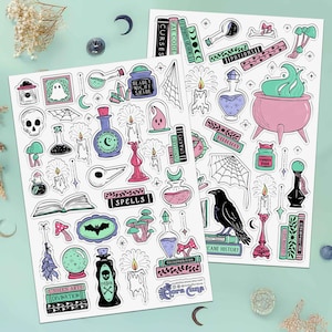 Set of 2 large sticker sheets with 75 witchcraft themed stickers in a pink, periwinkle and teal color scheme. Stickers’ imagery includes: spider webs, mushrooms, melting candles, grimoires, skulls, potions, a raven, crystals, and spooky wall art