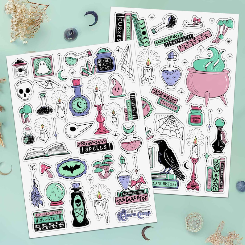Set of 2 large sticker sheets with 75 witchcraft themed stickers in a pink, periwinkle and teal color scheme. Stickers’ imagery includes: spider webs, mushrooms, melting candles, grimoires, skulls, potions, a raven, crystals, and spooky wall art