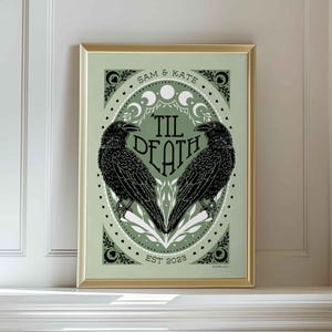 Unframed matte print that features 2 ravens in the shape of a heart & the words, “til death” in the center. Moon phases, botanical illustrations and hearts surround the ravens. The couple’s first names and anniversary date are arched on top and bot