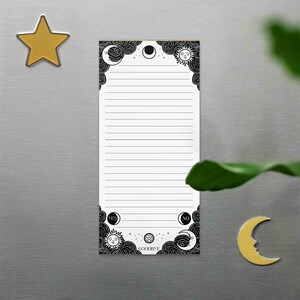 This photo shows the magnetic spirit board notepad on a fridge