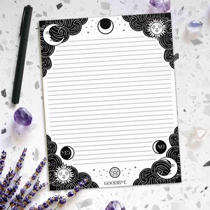 May include: Black and white lined paper with a moon and sun design. The paper has a border of clouds and stars. The words "YES", "NO", and "GOODBYE" are written on the paper.