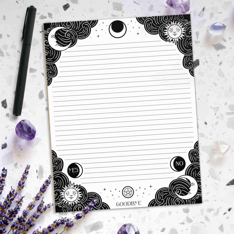 This photo shows a 8.5 by 11 inch notepad that has illustrated black swirling clouds with a crescent moon and sun with faces in each corner. There is a crescent moon with sparkles  in the center at the top and a pentagram with sparkles and the word Goodbye at the bottom of the notepad. The words yes and no are also close to the bottom, and the whole notepad is college ruled lined. The design is inspired by spirit boards.