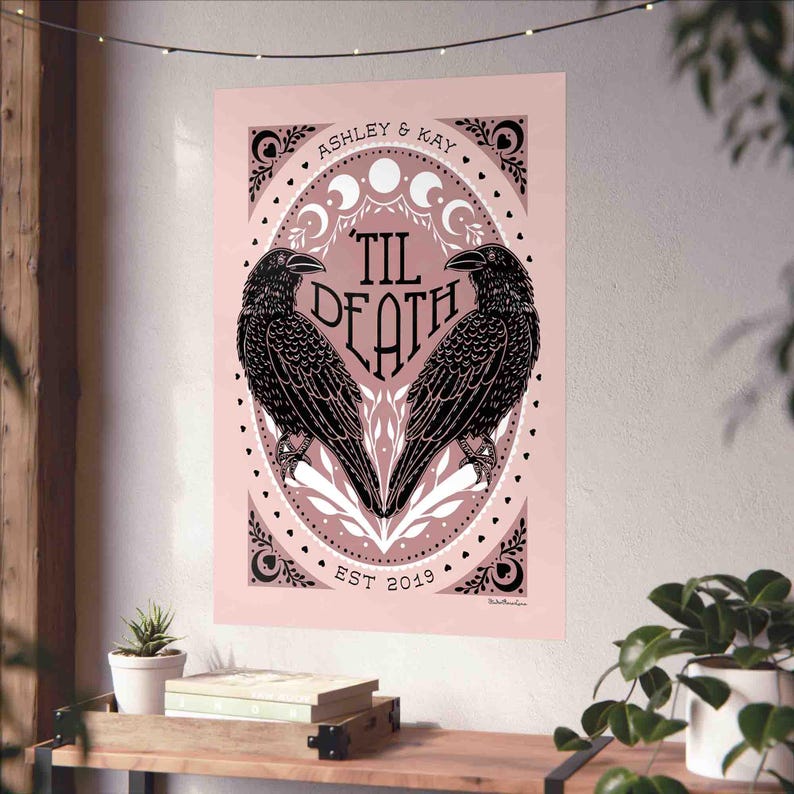 Unframed matte print that features 2 ravens in the shape of a heart & the words, “til death” in the center. Moon phases, botanical illustrations and hearts surround the ravens. The couple’s first names and anniversary date are arched on top and bot