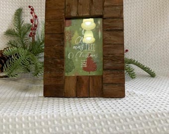 May include: A rectangular wooden picture frame with a Christmas-themed image inside. The frame is made of small, rectangular pieces of wood. The image features a Christmas tree and the words "Christmas Tree O Christmas".