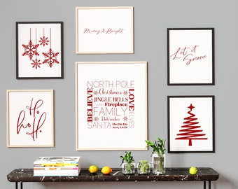 May include: A set of six framed Christmas-themed prints with red text and designs. The prints include snowflakes, a Christmas tree, the words "Ho Ho Ho", "Let it Snow", "Merry & Bright", and a word cloud with Christmas-related words.