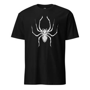 May include: Black t-shirt featuring a white spider graphic design.