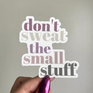 May include: A white sticker with the text "don't sweat the small stuff" in purple, gray, and white lettering.