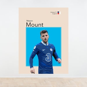May include: A digital illustration of a soccer player wearing a blue jersey with the number 3 on the front. The player is standing on a blue background. The text "Mason Mount" is above the player and the text "Chelsea F.C. England" is above the text "Mason Mount".
