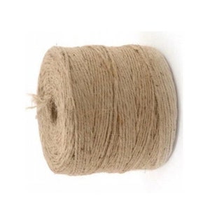 May include: A roll of natural twine, made from jute fiber, is a natural brown color. The twine is wound tightly on a spool.