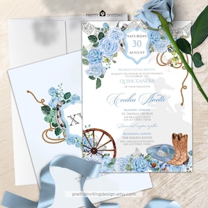 May include: Elegant quinceañera invitation suite featuring a light blue floral design with roses, a horseshoe, and a wagon wheel. The invitation includes event details and the text "Cecilia Anette". The suite includes an envelope and a matching card.