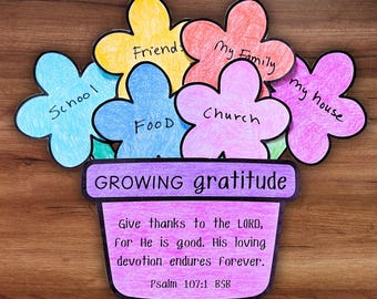 May include: A colorful paper craft depicting a flower pot with flower-shaped petals. The petals are labeled with words like "School," "Friends," and "My Family." The pot reads "GROWING gratitude" and includes a Bible verse.