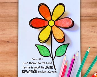Peut inclure: Une feuille de papier blanc avec une fleur en papier superposée en trois dimensions aux pétales orange, jaunes et rouges et aux feuilles vertes. Le texte indique : Psalm 107:1 Give thanks to the Lord, for he is good; his LOVING DEVOTION endures forever.
