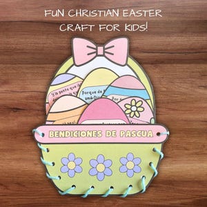 May include: A colorful Easter craft for kids featuring a basket filled with eggs. Each egg has a different Easter message written in Spanish. The basket is decorated with flowers and has a bow on top. The text on the basket reads "Bendiciones de Pascua" which means "Easter Blessings" in English.