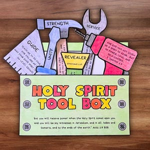 May include: A colorful, handmade Holy Spirit Tool Box with various tool-shaped cards. The toolbox features the text "HOLY SPIRIT TOOL BOX" and Bible verses. Tools include a hammer, wrench, drill, and ruler, each labeled with a spiritual concept.